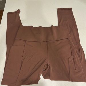 Athleta salutation stash pocket II tight